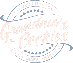 Grandma's Cookies logo in peach and blue featuring circular design with decorative hearts and flourishes, text reads 'St. Charles, Missouri' around the perimeter.